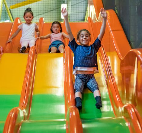 Girls on indoor slide