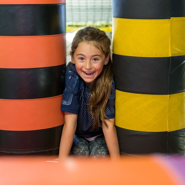 Girl playing on vertical rollers